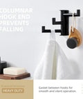 Super Slick Swivel Towel Hook With Three Turning Arms Matte Black Wall Mount Coat Rack displaying towel and bath accessory.
