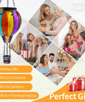 Colorful Hot Air Balloon Solar Lantern with Flickering Flame Light shown as a perfect gift for various occasions in photos.
