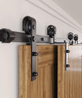 Black Rustic Bypass Sliding Barn Door Hardware Kit For Two Doors, 8ft Flat Track With Classic Roller System installed on wooden doors