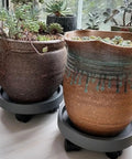 11 Inch Heavy Duty Plant Caddie With Wheels Rolling Planter Stand And Wheeled Pot Trolley holding pots on marble floor