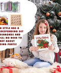 Girl holding framed Merry Christmas 13 Piece Interchangeable Holiday Diamond Art Kit Set For Adults with tools displayed.