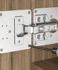 Heavy Duty Stainless Steel Cabinet Hinge Repair Plate Kit With Five Pre Drilled Holes And Matching Screws, installed on wooden cabinet.