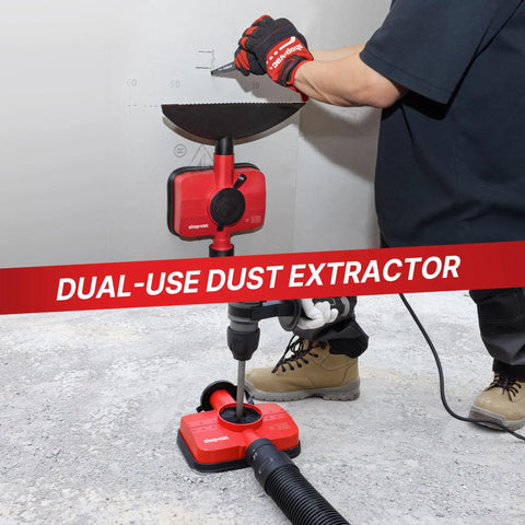 2-In-1 Vacuum Dust Collection Attachment For Drilling And Drywall Cutting connected to a shop vacuum on job site floor