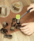 All In One Leather Corner Punch Kit with 18 High Speed Steel Dies, shown with rubber mallet and die set on leather surface.