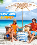 Family with Go To Extra Large Beach Bag With Waterproof And Sandproof Zipper on vacation by the ocean under umbrella