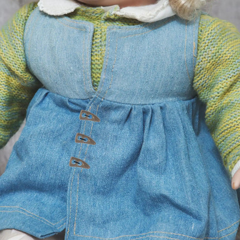 Doll's blue dress with three golden mini buttons, part of 100Pc Mini Buttons For Doll Clothes DIY Fasteners Kit