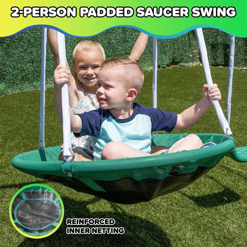 Children playing on the 32in saucer swing of the Northridge Metal Swing Set With Five Seat Swing 500 Lb Capacity 32 Inch Saucer Swing Two Blow Molded Swings And Five Foot Slide Durable Six Foot Frame Backyard Playset For Kids Ages Three To Eight.