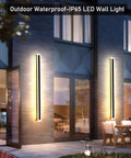 Two Pack 23.6 Inch Outdoor Modern LED Wall Light 18W IP65 Waterproof Black Wall Mount Fixture With Frosted White Acrylic Rectangular Design For A Brightly Lit Porch And Exterior installed on a modern house wall.