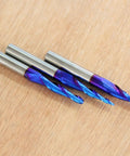 Three Pack Tapered Ball Nose Router Bits One Eighth One Sixteenth One Thirty Second Inch Cutting Diameter One Quarter Inch Shank Sweet Nano Blue Coated Up Cut Solid Carbide CNC Bits For 2D And 3D Carving Two And A Half Inch Overall Length on wood surface