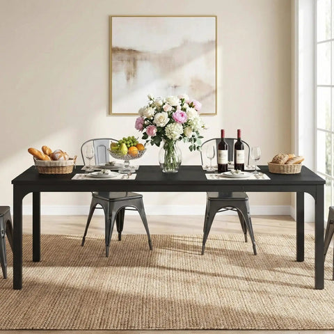 Extra Long Dining Table With Badass Steel Legs, Rectangle Kitchen Table And Dinner Spot Seats The Whole Squad Comfortably, modern black wood top, set for dining with flowers and wine.