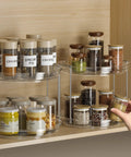 Smooth Spinning Two Tier Lazy Susan Turntable Organizer For Kitchen Pantry Fridge And Bathroom Vanity Spice Rack Storage Total No Fuss Slick Compact 9.25 Inch Dual Pack System with spices on shelves.