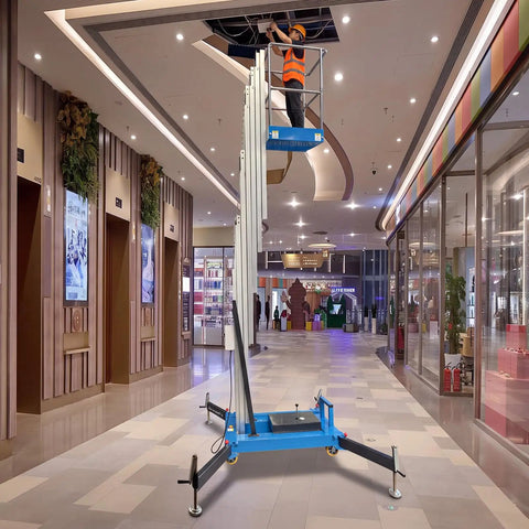 Slick Electric Hydraulic Single Mast Lift in a mall, max height 26.25 ft, with a worker repairing the ceiling.