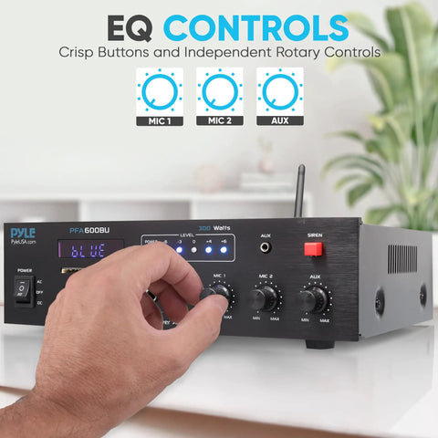 Person adjusting 300W Bluetooth Karaoke Amplifier With 2 Channel PA System, FM Radio, USB SD, AUX, Two Mic Inputs, Siren Alarm, 12V Power Option