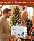 Family exchanging gift box labeled 'Bird Feeder Camera' in festive living room decorated for Christmas.