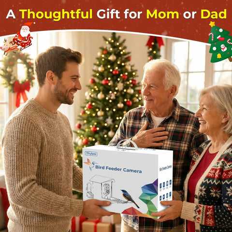 Family exchanging gift box labeled 'Bird Feeder Camera' in festive living room decorated for Christmas.