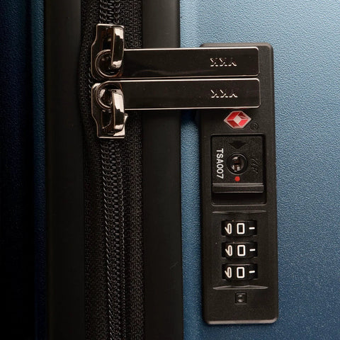 Close-up of TSA lock on 26 inch polycarbonate spinner luggage in matte navy.