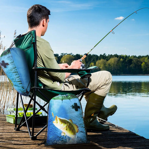Man fishing by lake with 20 Pcs Fishing Party Favors Drawstring Backpacks 17 by 13.4 Inches Fish Theme Gift Bags on chair