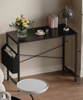 32 Inch Computer Desk For Small Spaces With Storage Bag And Headphone Hook Space Saving Home Office Work Desk For Study Writing Table Ideal For Dorms Teens And Kids, black metal desk with storage bag, table lamp and books on top, ideal for small rooms.