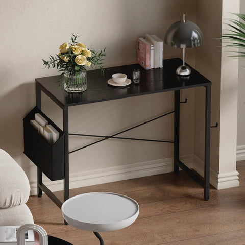 32 Inch Computer Desk For Small Spaces With Storage Bag And Headphone Hook Space Saving Home Office Work Desk For Study Writing Table Ideal For Dorms Teens And Kids, black metal desk with storage bag, table lamp and books on top, ideal for small rooms.