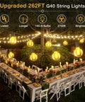 Outdoor scene with 262Ft Outdoor G40 LED String Lights Waterproof Patio Lights illuminating tables for party setup.