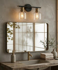 Dual Matte Black Wall Sconce Lights For Bathrooms With Clear Glass Shades And Antique Brass Finish over vanity mirror