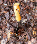 Heavy Duty 18 Gauge Stainless Steel Soil Scoop With Serrated Edge And Recycled Handle in mulch bed for soil transfer