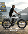Man riding Powerful 2500W Peak Electric Fat Tire Bike for Adults with 52V 20Ah Battery, dual suspension in mountain range