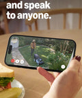Phone displaying live view of lawn through Outdoor Battery Security Camera Stick Up Cam with Live View and Color Night Vision.