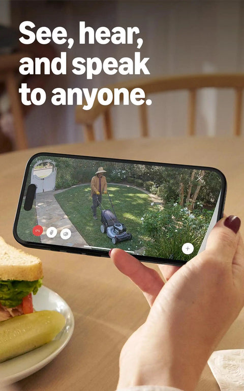 Phone displaying live view of lawn through Outdoor Battery Security Camera Stick Up Cam with Live View and Color Night Vision.