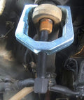 Close-up of Beefed-Up Heavy Duty Pitman Arm Puller with drop forged yoke in use, 1-5/16 inch opening, 2-1/2 inch depth