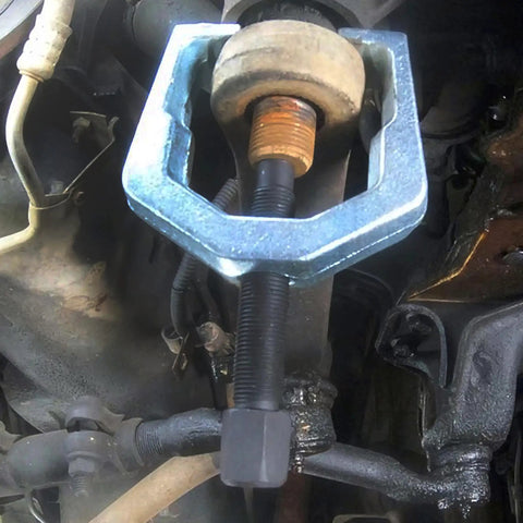 Close-up of Beefed-Up Heavy Duty Pitman Arm Puller with drop forged yoke in use, 1-5/16 inch opening, 2-1/2 inch depth