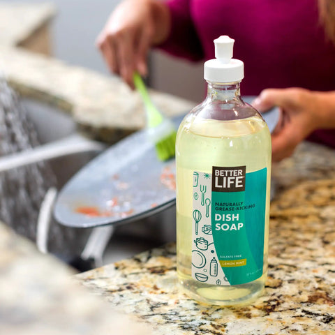 Grease Busting Liquid Dish Soap With Vitamin E And Aloe For Sensitive Skin No Gloves Needed Lemon Mint Scent Septic Safe 22 Oz bottle on kitchen counter