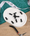 8 Piece Cabinet Door Repair Pins Set For Damper Replacement And Furniture Fittings, black plastic pins on white plate with tools