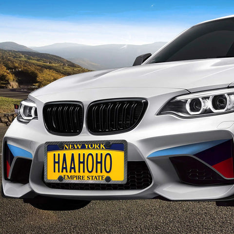 White car front view with New York license plate 'HAAHOHO', mounted with black stainless steel license plate screws kit with matte black caps.