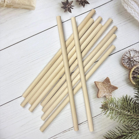 Solid Birch Wood Dowel Rods For Crafting, 3/8 X 12 Inch Unfinished Wooden Sticks, 10 Pack on a wooden surface.