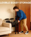 Person folding All In One Beginner Electric Drum Set With Four Quiet Eight Inch Pads, Three Ten Inch Cymbals, 120 Sounds