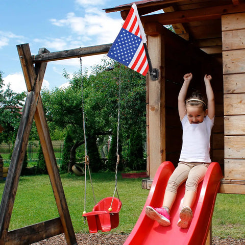 Outdoor Double Sided USA Flag Kit With Pole And Mounting Hardware For Treehouse And Backyard Decor, Premium 15.5 x 10.5 Inch USA Flag displayed on treehouse with child sliding