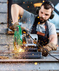 Man using cutting tool while wearing Bulk 48 Pairs Clear Safety Glasses Anti Fog Eyewear For Men And Women, scratch resistant