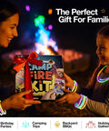 Family using Ultimate Campfire Fun Kit With Color Changing Flame Packs Glow Sticks And Fire Starters outdoors at night