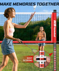 Two women playing with Outdoor Badminton Net Set With Anti Sag Winch System, 20ft Net, 4 Rackets, 3 Shuttlecocks And Carry Bag