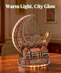 Moon City 3D DIY Puzzle With LED Light, wooden night city model glowing on a desk with a cozy brown finish, decorative sculpture