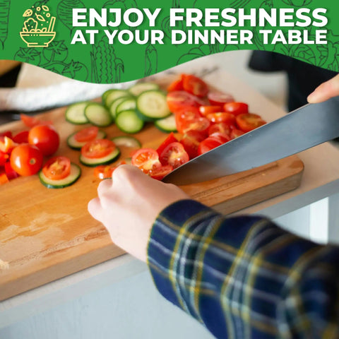 Slicing fresh tomatoes and cucumbers on a wooden cutting board in a kitchen setting