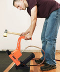 Man using All In One Flooring Nailer And Stapler For 16 Gauge T And L Cleats And 15.5 Gauge Staples From One Point Five To Two Inches