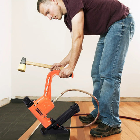 Man using All In One Flooring Nailer And Stapler For 16 Gauge T And L Cleats And 15.5 Gauge Staples From One Point Five To Two Inches