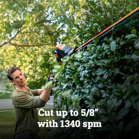 Man using Cordless 20V Hedge Trimmer With 10 Position Adjustable Head, 2 In 1 Attachment Capable Design on tall hedge