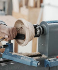 Straight Shooter 3 Inch Wood Lathe Chuck Featuring 4 Reversible Jaws With Self Centering Action for shaping a wooden bowl on a lathe.