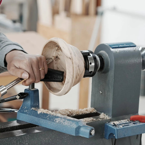 Straight Shooter 3 Inch Wood Lathe Chuck Featuring 4 Reversible Jaws With Self Centering Action for shaping a wooden bowl on a lathe.
