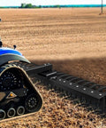 49 Inch Landscape Rake Attachment With 17 Spring Steel Tines for lawn tractors and ATV UTVs shown in use on a field