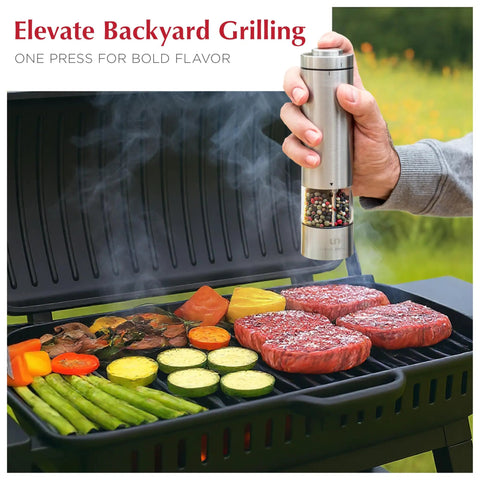 Battery Operated Salt And Pepper Grinder Set With Light Stainless Steel Mills in use over a barbecue with vegetables and steak