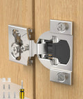 Close-up of Twenty Pack Heavy Duty Soft Close Cabinet Hinges For Half Inch Overlay Face Frame Doors with screws and screwdriver.